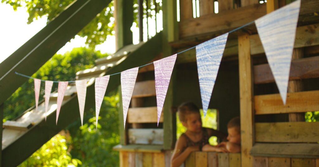 Kids playing outside during a summer day, highlighting summer snacking for busy families.